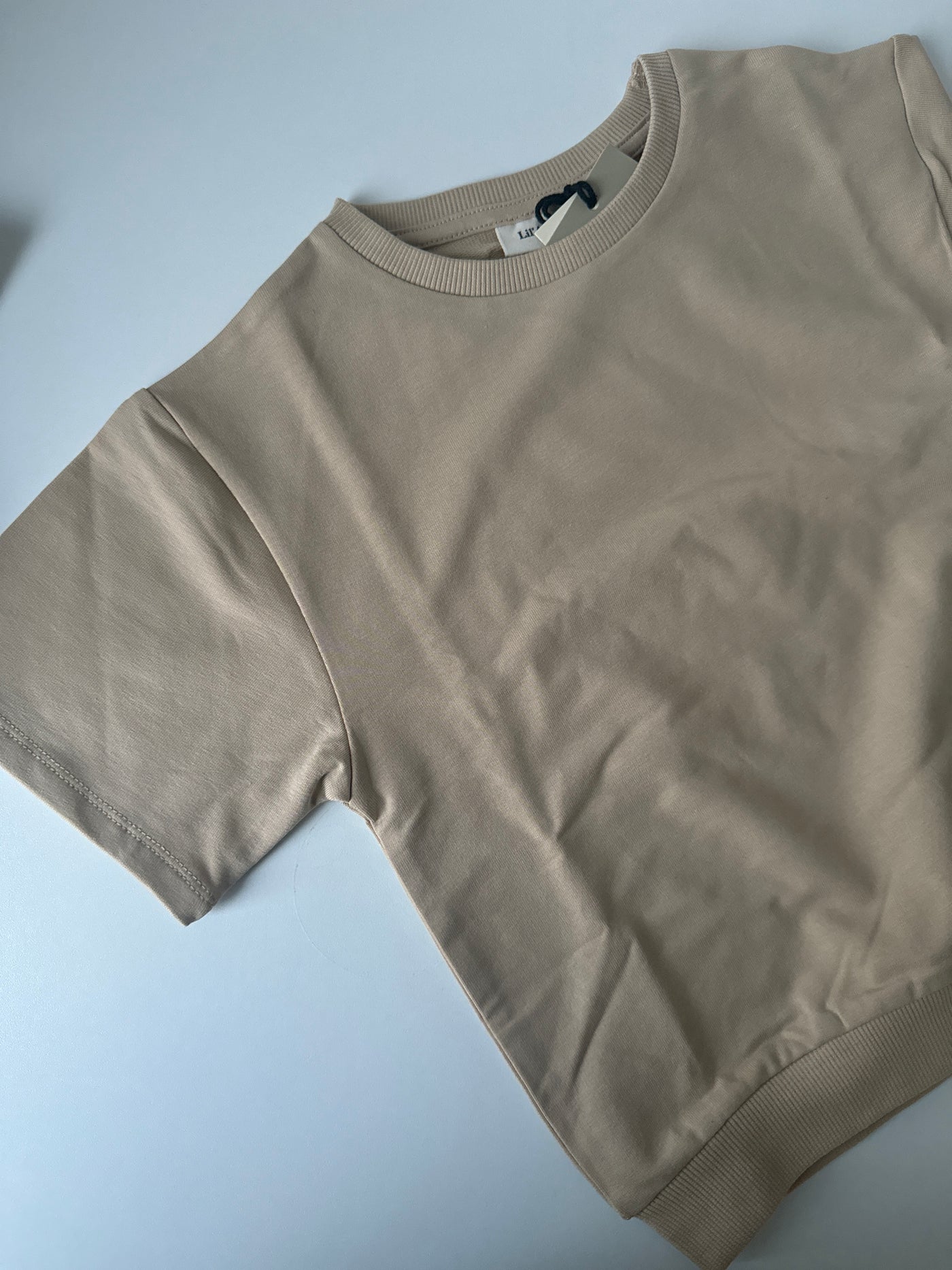 Lil Atelier - T-shirt 'NMMOMADS SS LOOSE SWEAT LIL - Irish Cream'